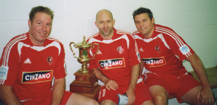 TEAM RECOGNITION: Brett Pence, left, with the Canadian Soccer League Championship trophy and Winnipeg Fury teammates Mike Dodd and Carlo Corazzin in 1992.